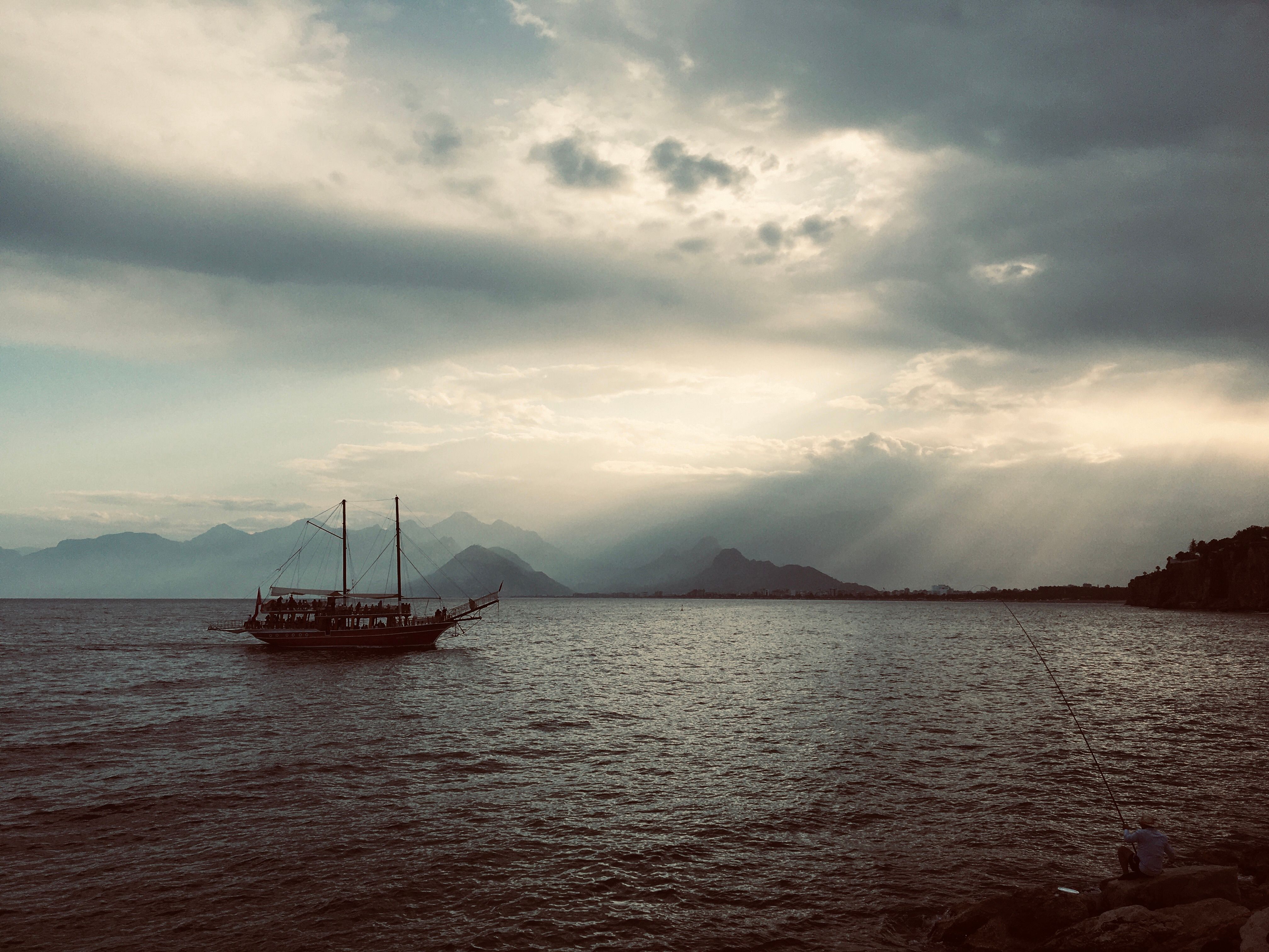 Boat in the Sea Under Cloudy Sky · Free Stock Photo
