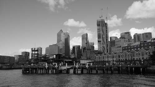 Free Grayscale Photo of the Buildings in a City by the Sea  Stock Photo