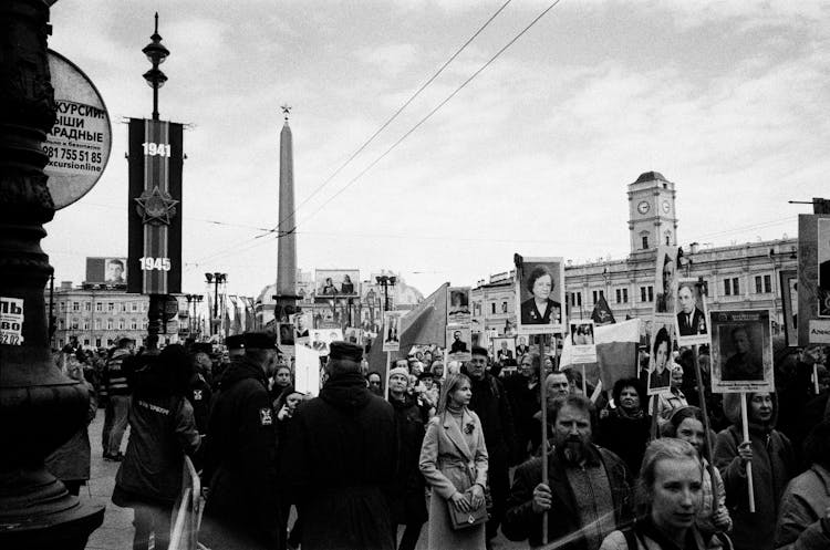 Grayscale Photo Of People Walking On Street