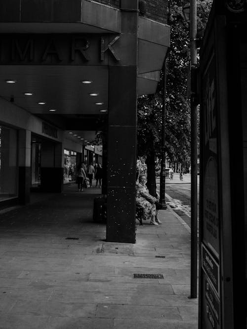 People Waiting under Roof of Bus Stop