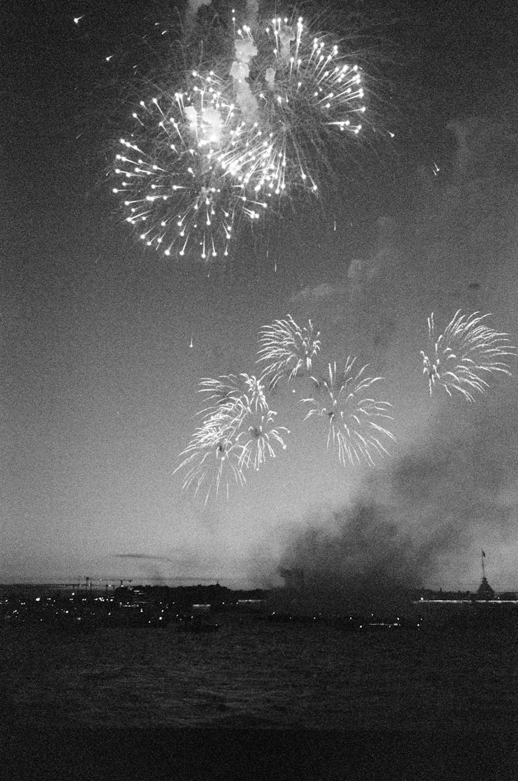 Black And White Photo Of Fireworks In The Sky