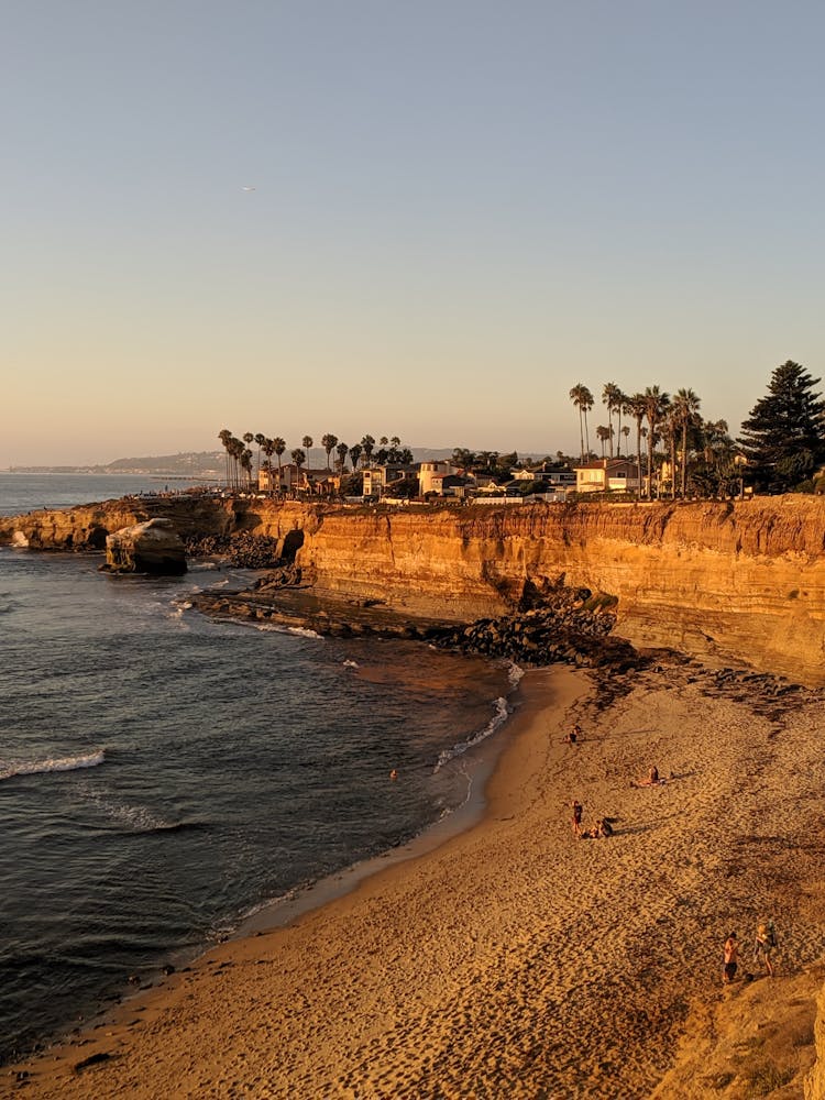 Beach And Cliffs At Sunset