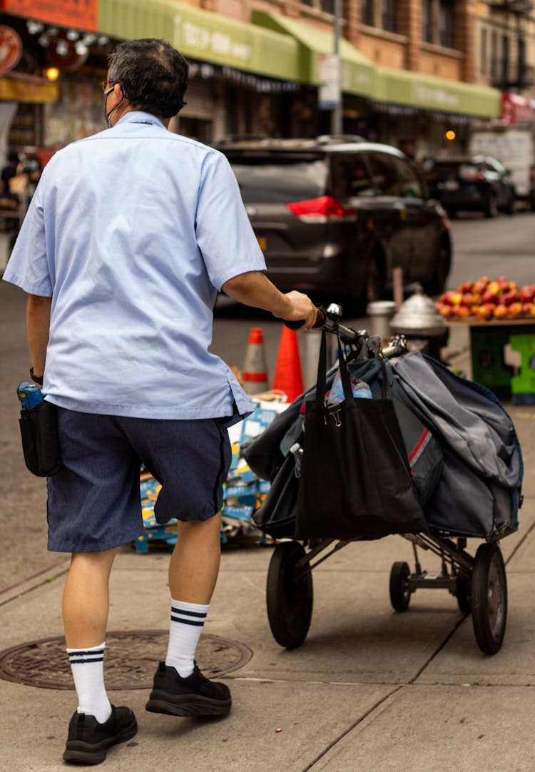 Man Walking With Stroller