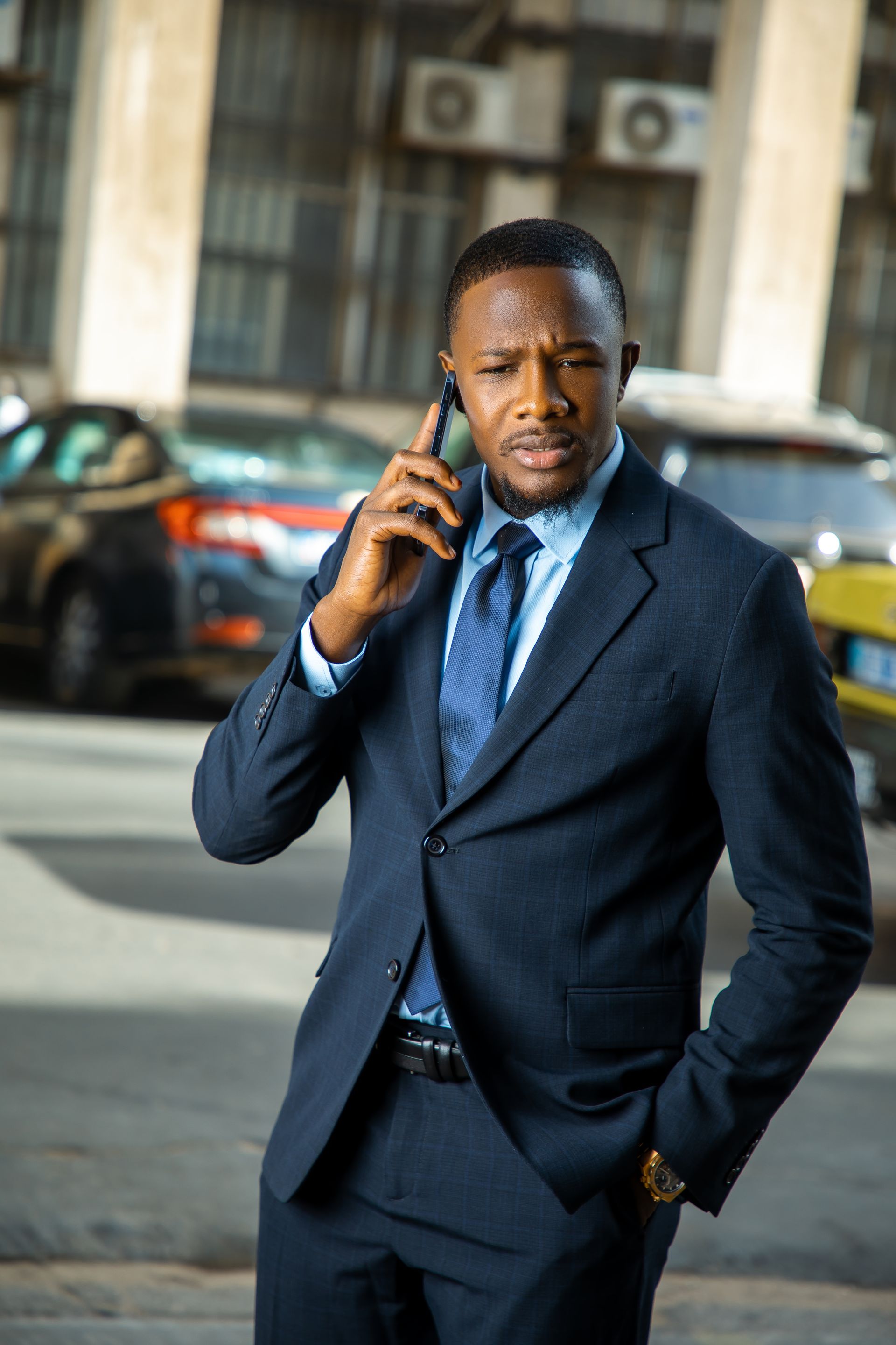 African businessman on a call while travelling in Dakar, Senegal