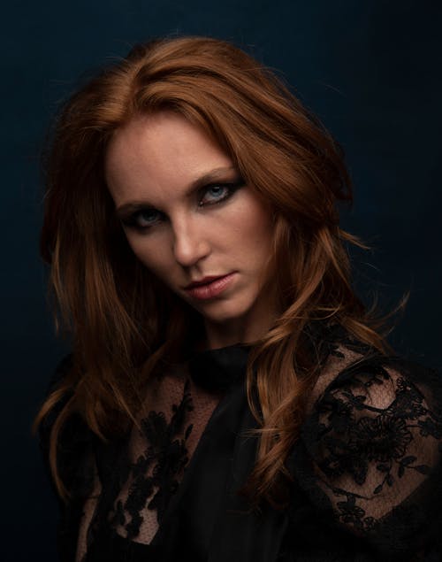 Redhead Woman with Long Hair and Blue Eyes