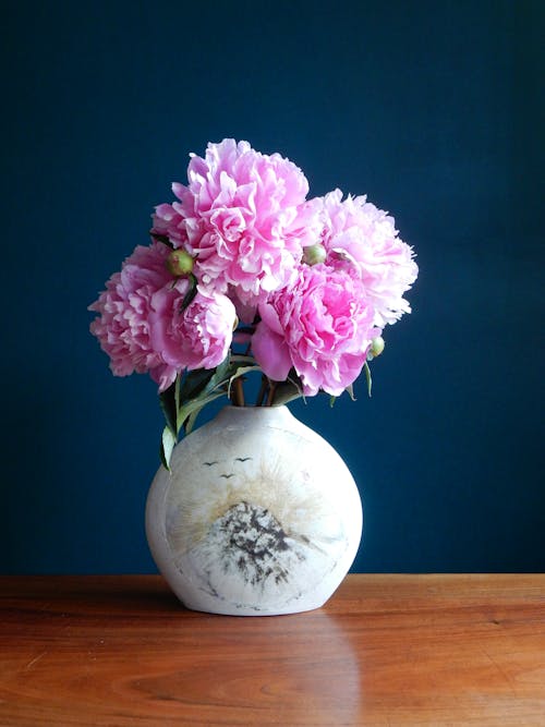 Free Ceramic Vase with Bunch of Peonies on Wooden Surface Stock Photo