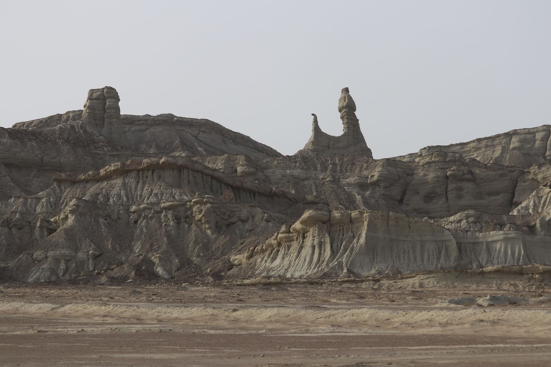 Explore the dramatic rock formations in Gwadar, Balochistan, showcasing nature's artistry.