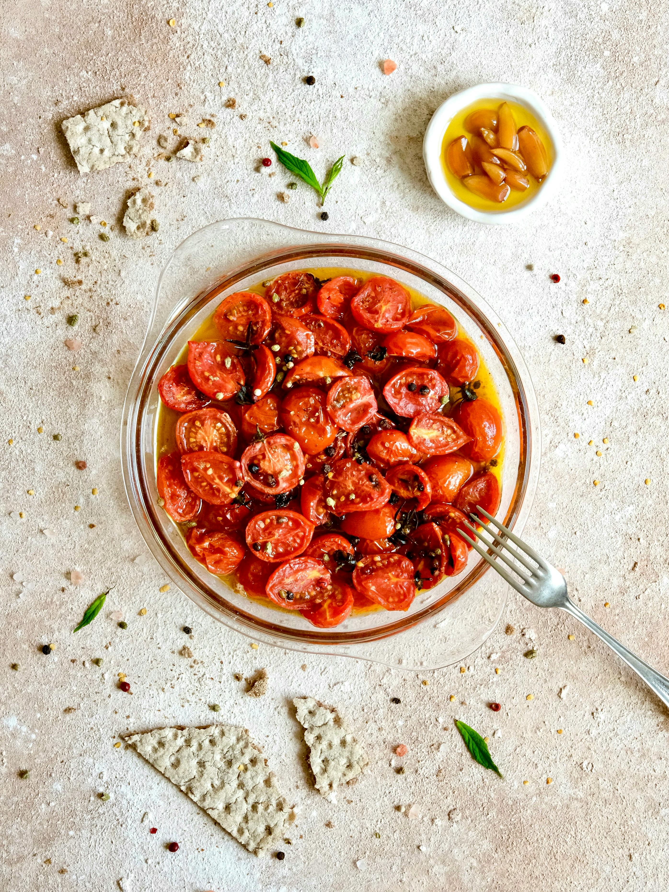 Fresh cherry tomatoes with olive oil, spices, and croutons, perfect for a light meal.