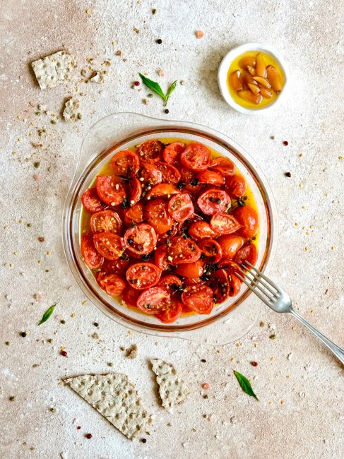 Fresh cherry tomatoes with olive oil, spices, and croutons, perfect for a light meal.