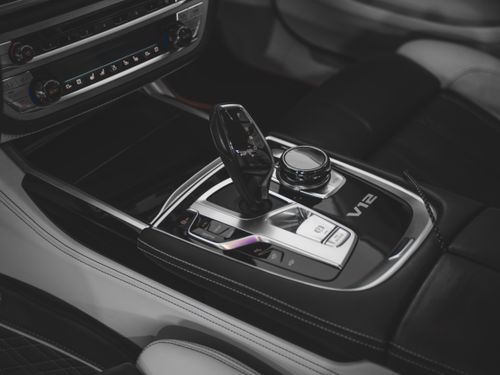 Free Close-up of a BMW car interior featuring a V12 engine and modern gearshift design. Stock Photo