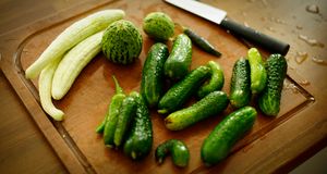 Fresh cucumbers on a wooden board — photo by Cihan Yuce on Pexels