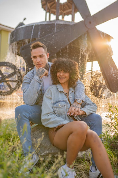 Couple Sitting by Windmill