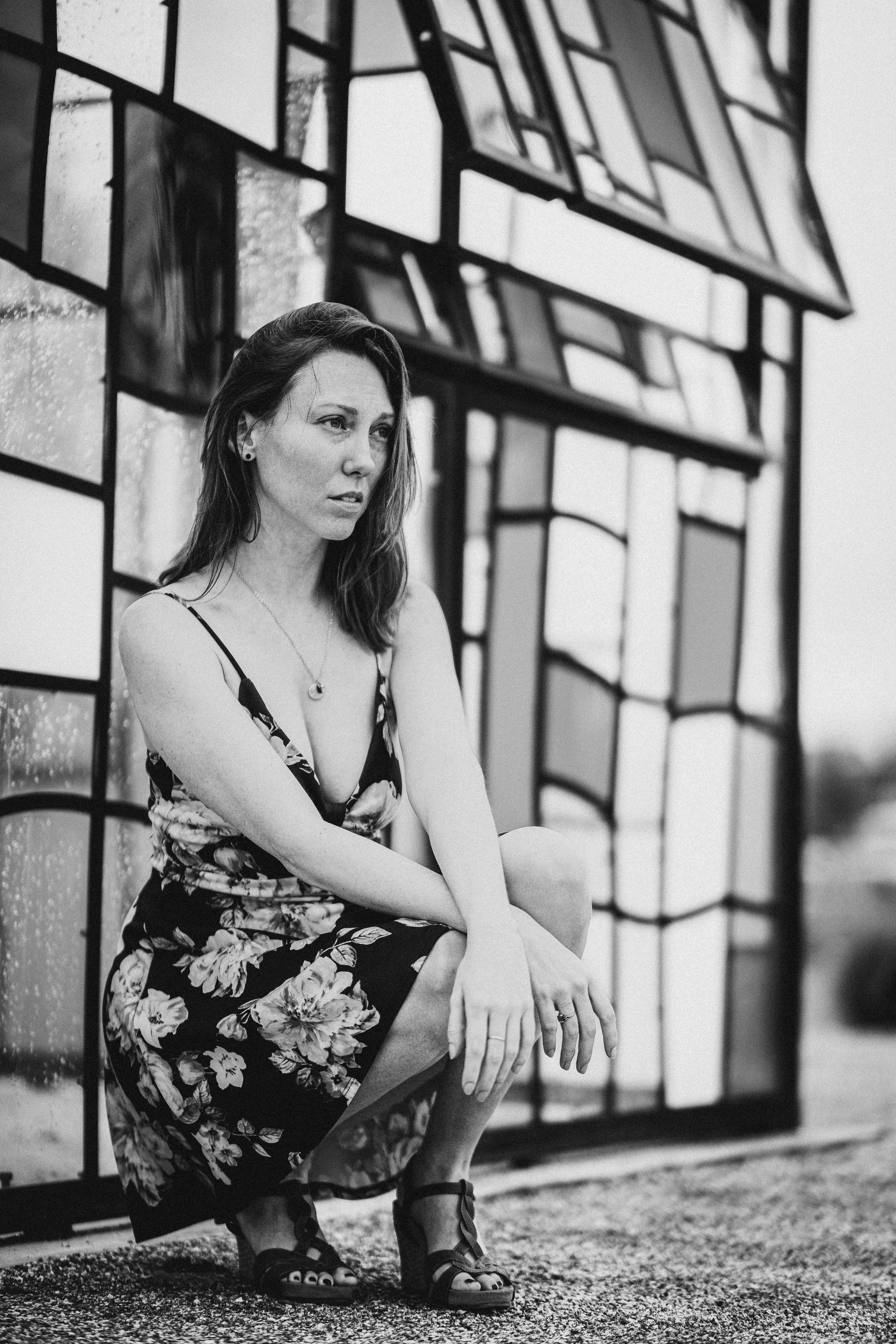Grayscale Photo of a Woman in a Floral Dress · Free Stock Photo