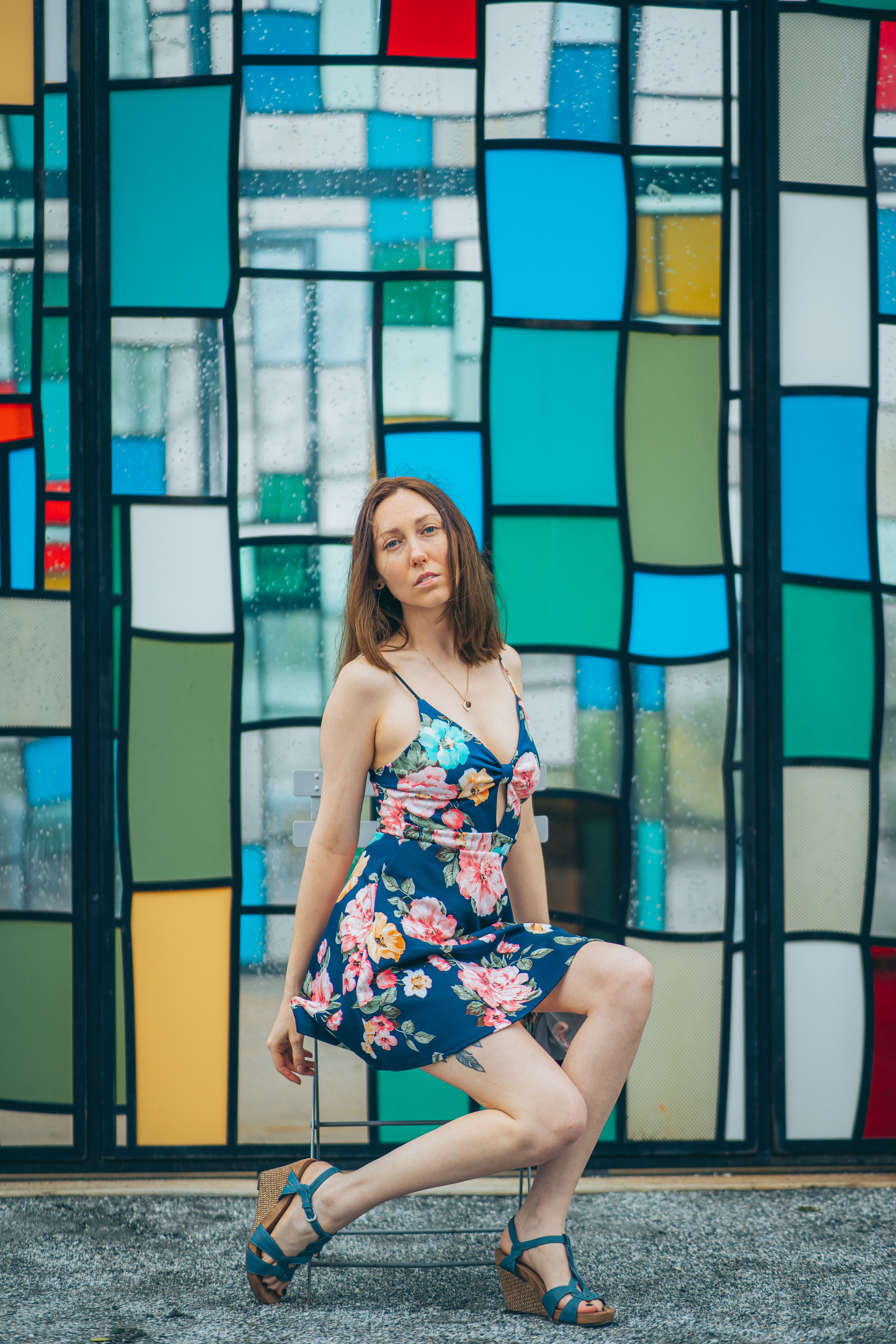 Woman in Blue Floral Dress Sitting on Chair · Free Stock Photo