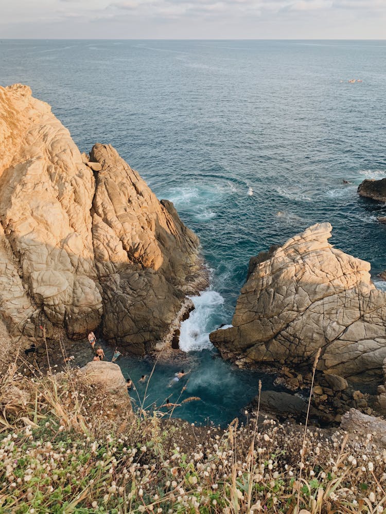 Photo Of A People Bathing In The Sea