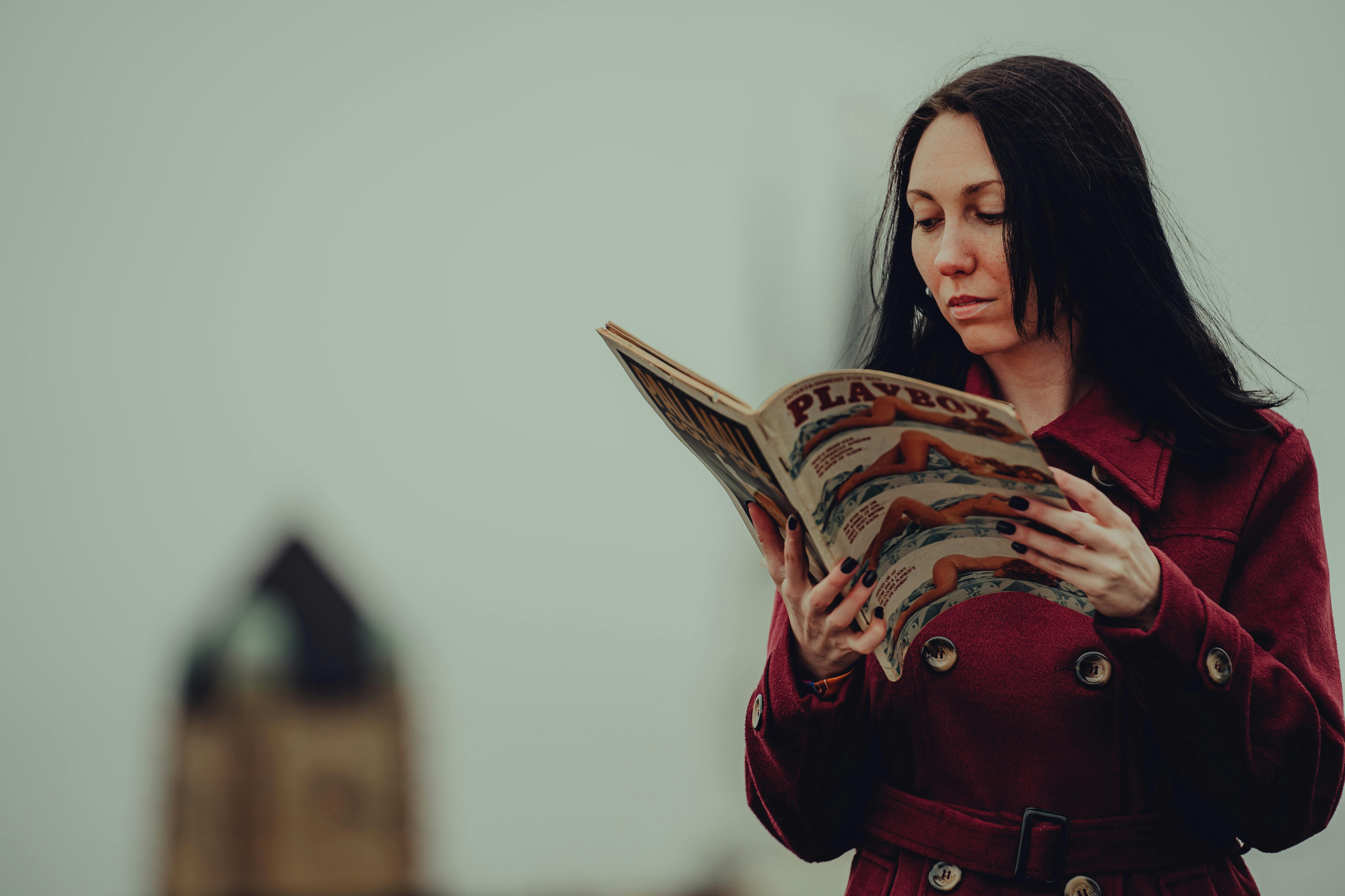 Woman Holding Playboy Magazine Cover · Free Stock Photo