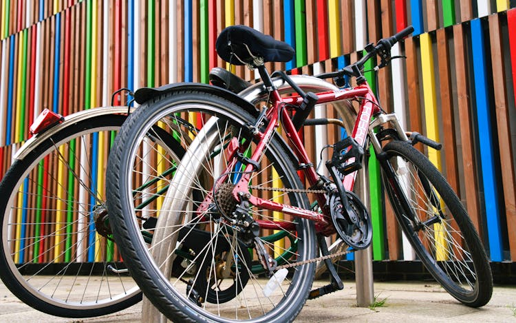 Two Bicycles On A Sidewalk