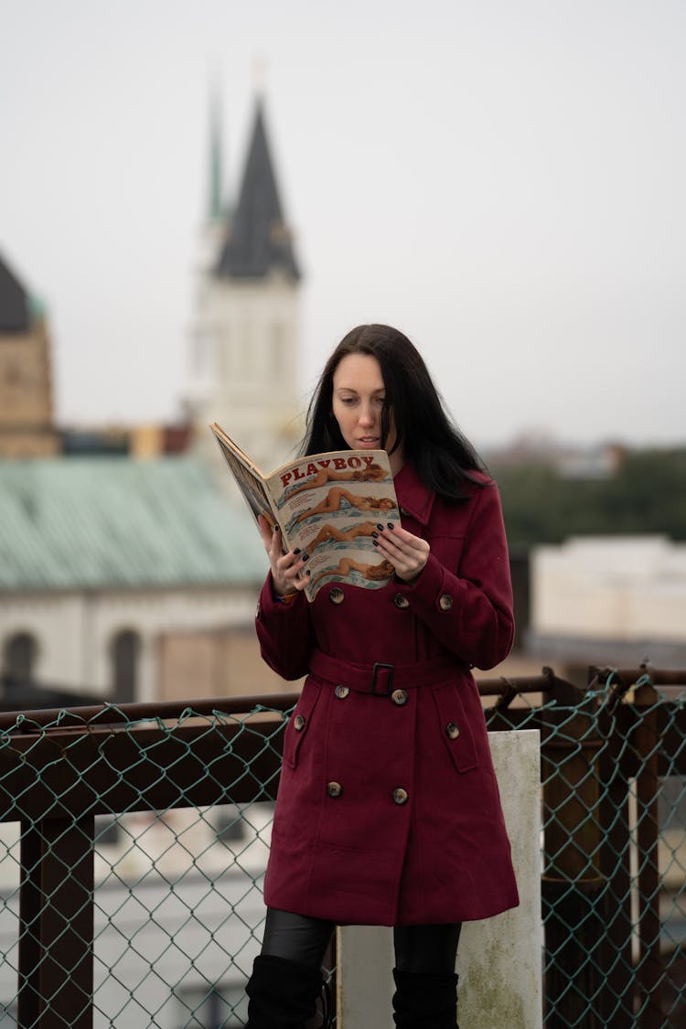 A Woman Reading A Magazine