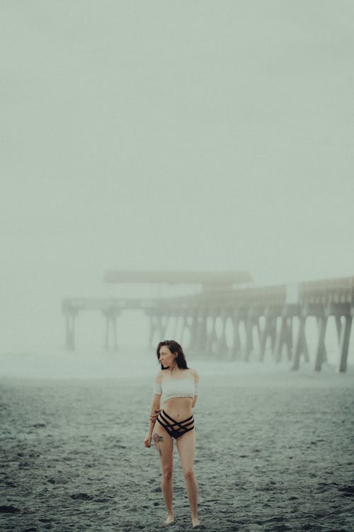 Woman in Tube Top and Bikini Bottom Near Sea Dock