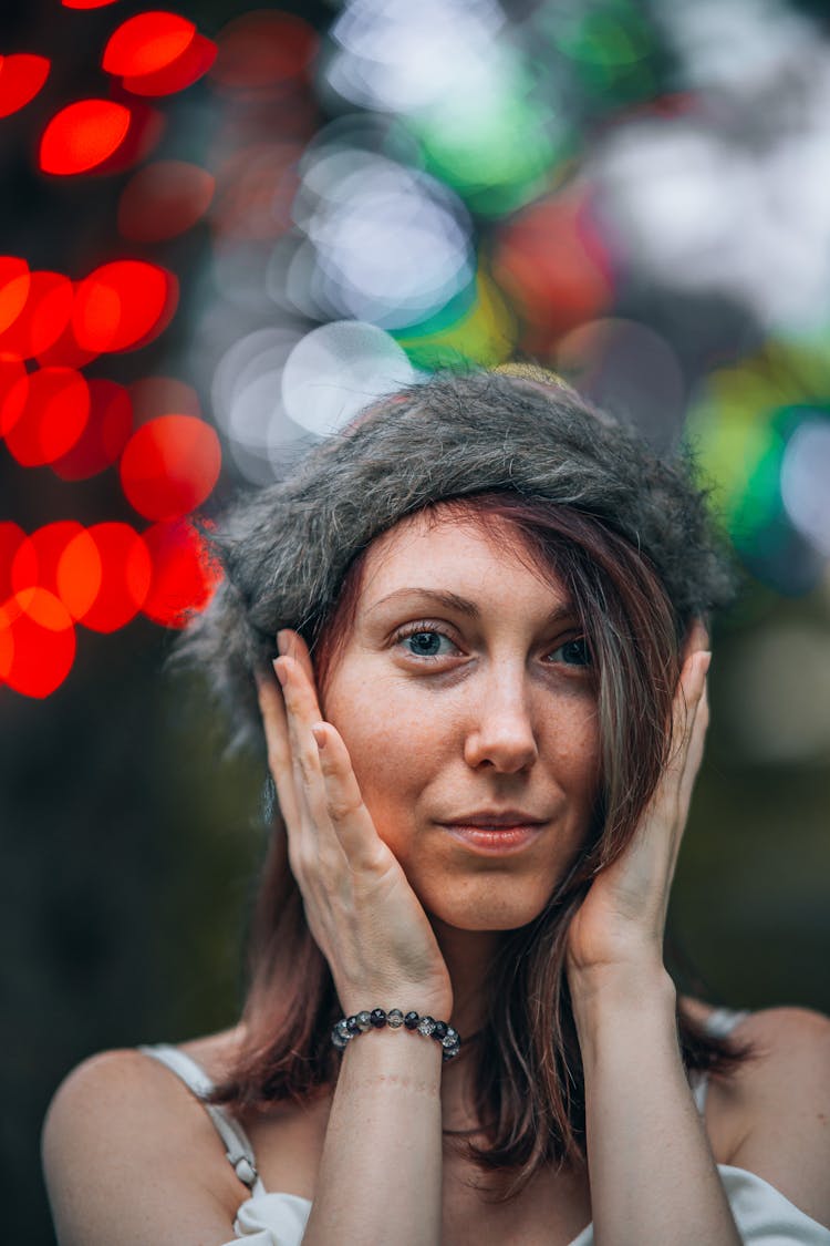 Portrait Of Woman In Fluffy Cap