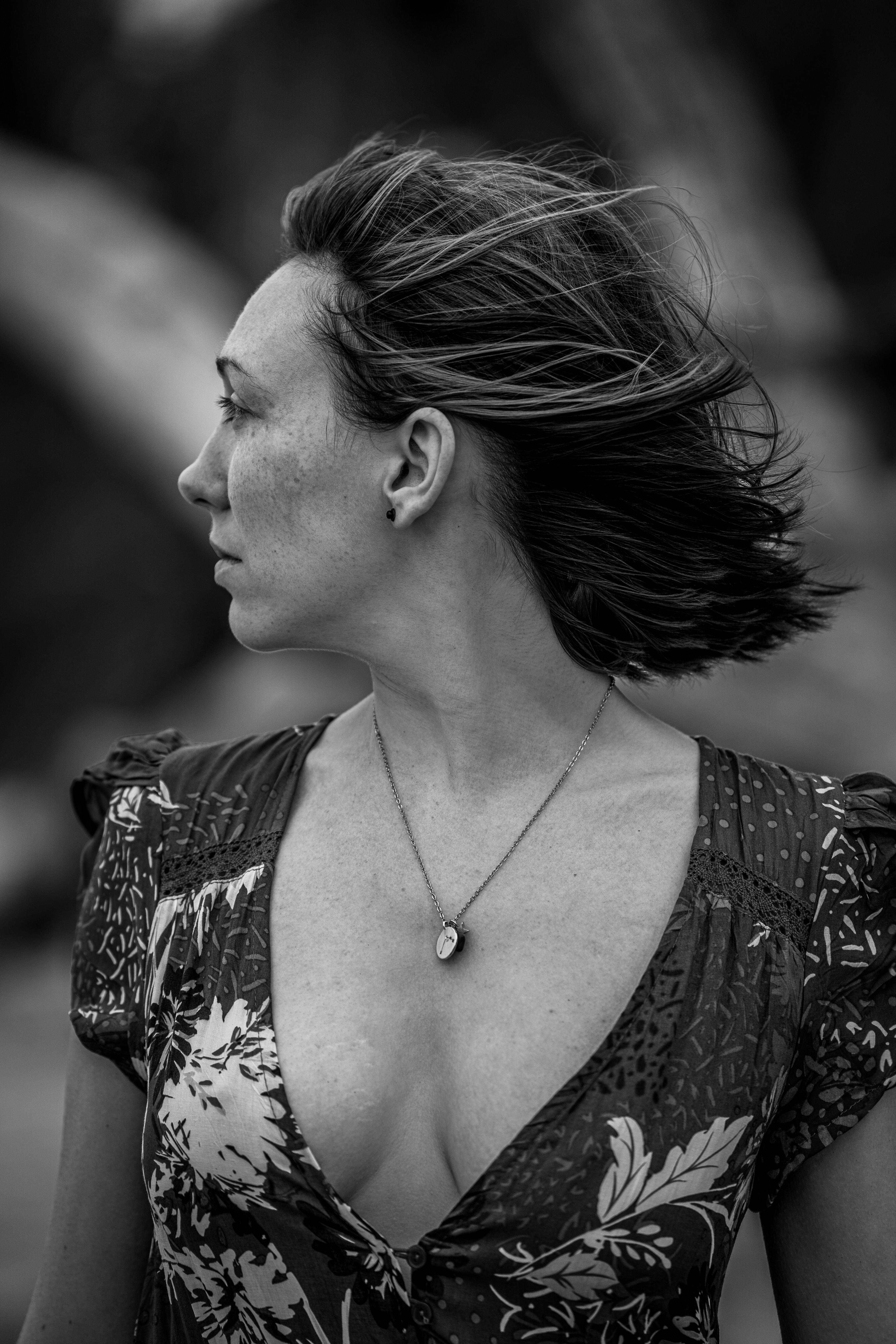 black and white photo of a woman in floral dress