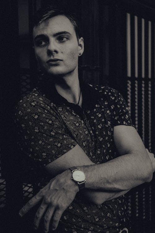 Black and White Photo of Man Wearing Wristwatch