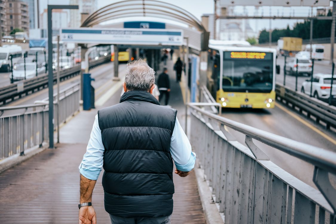 Bus Driver Walk Man Walking Down Ramp towards Bus Station · Free Stock Photo