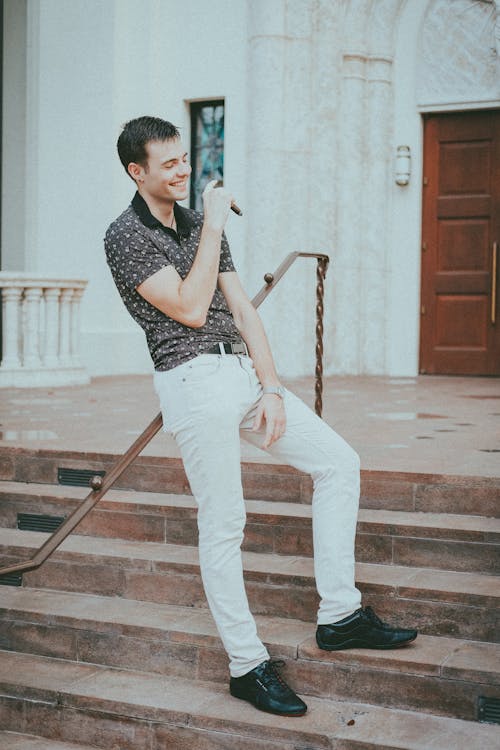 Man Standing on Stairs Smiling 