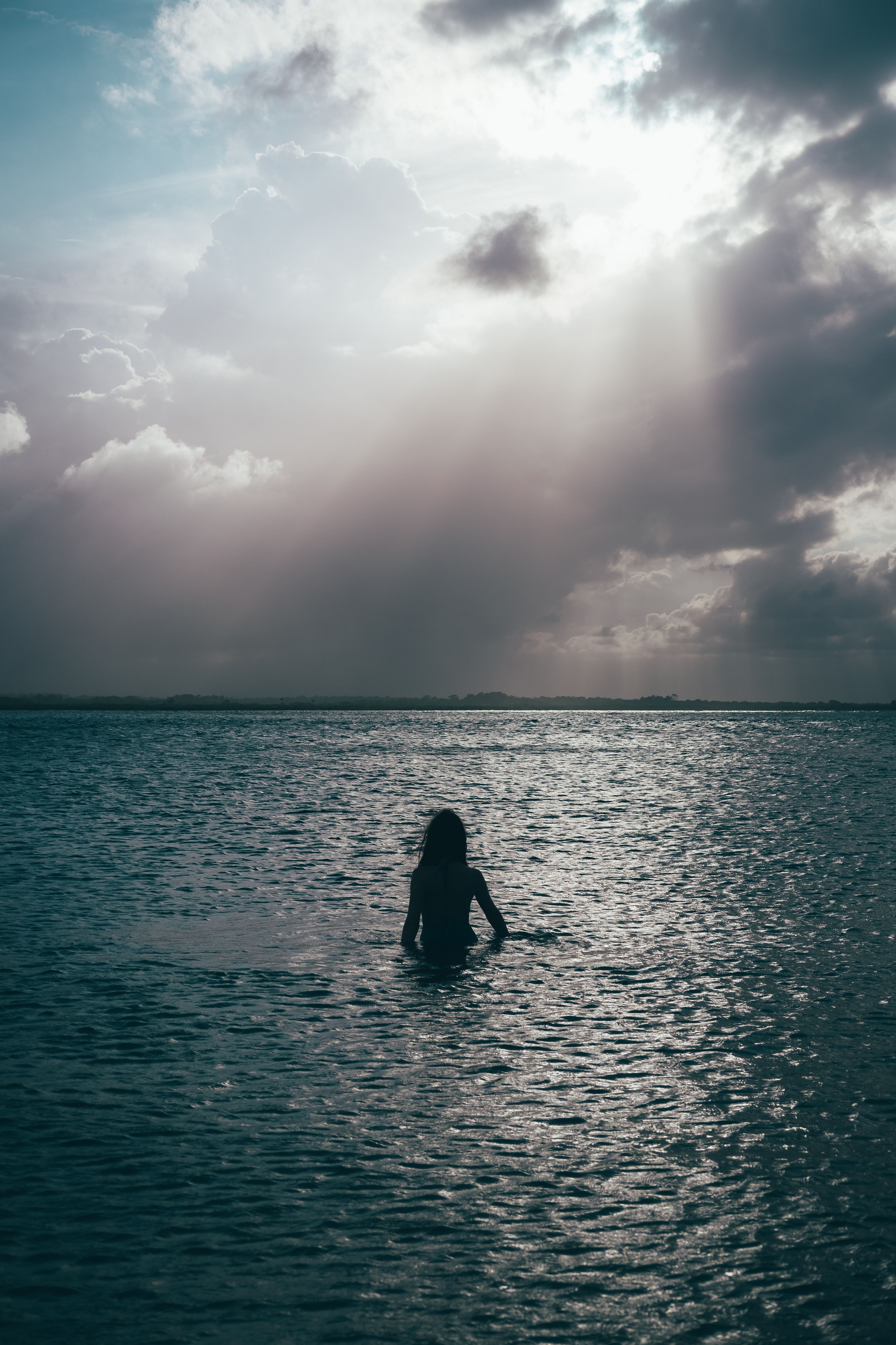Silhouette of Woman in Water on Sunset · Free Stock Photo