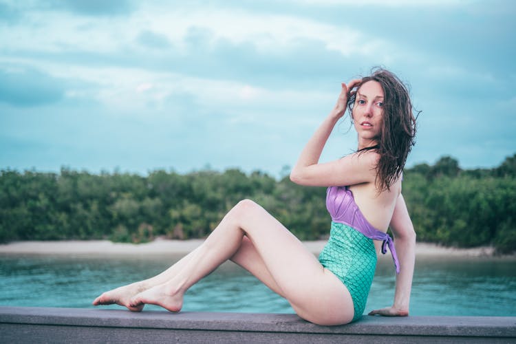 Woman In Swimsuit Posing Near Pool