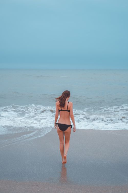 Woman in Black Bikini Standing on Beach · Free Stock Photo