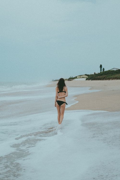 Woman in Black Bikini Standing on Beach · Free Stock Photo