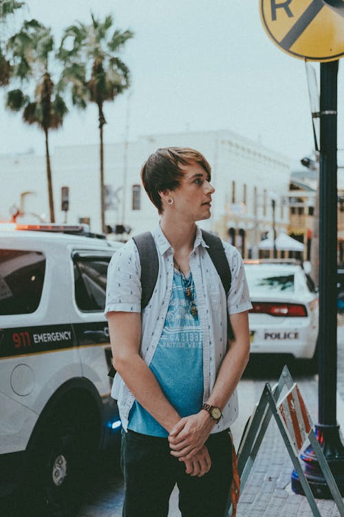 A Man on the Street Carrying a Backpack