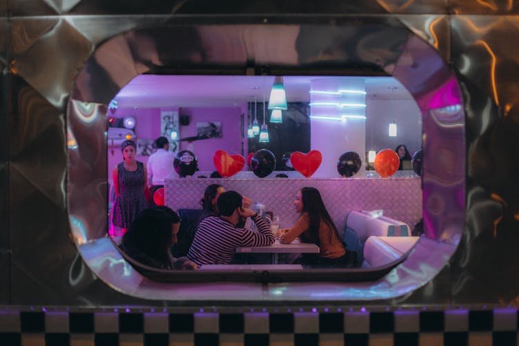 People In A Retro Diner