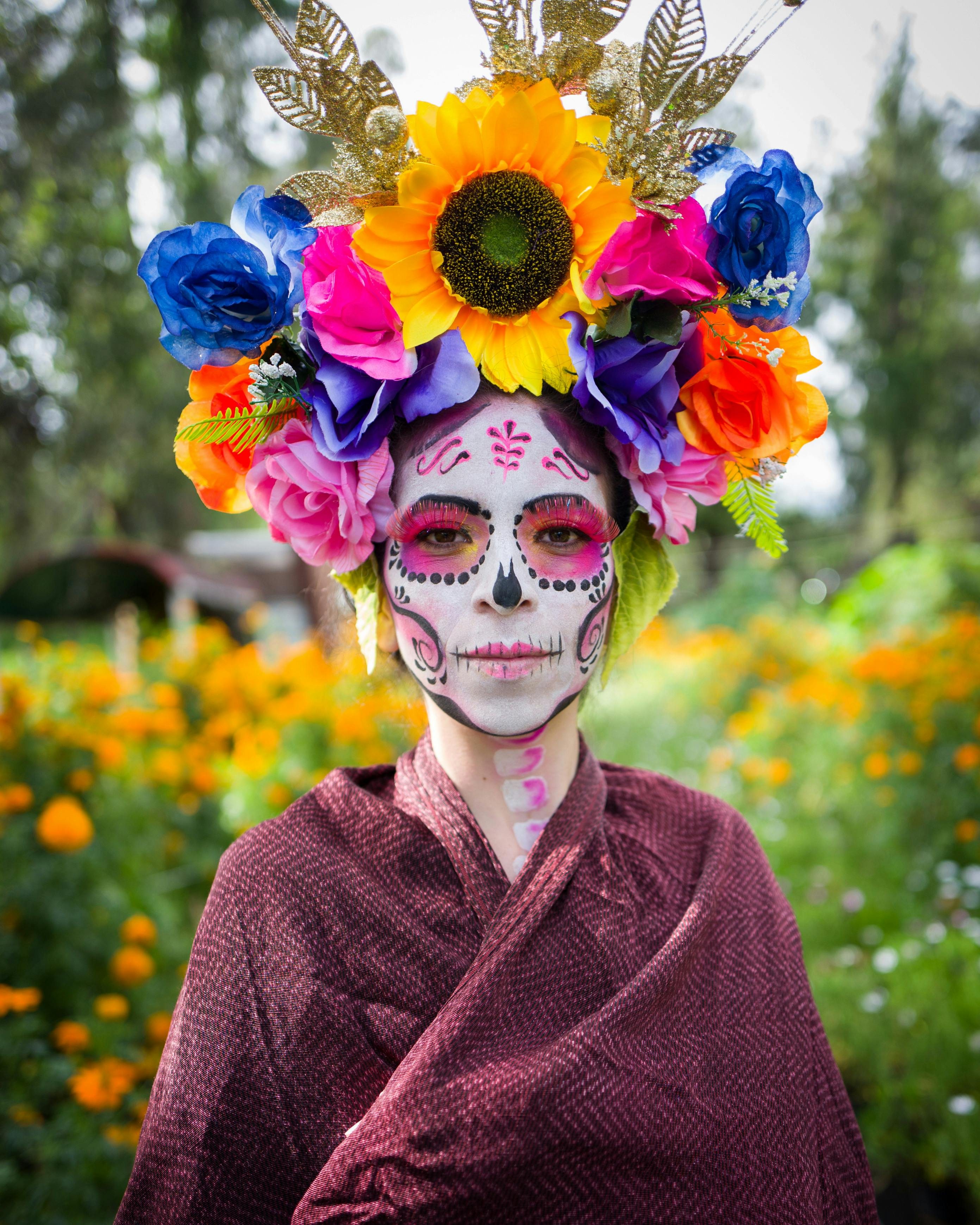 Woman With Red and Black Face Paint · Free Stock Photo