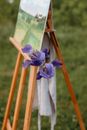 Purple Flower on the Side of the Easel Stand