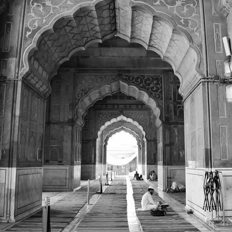 Busy People Sitting On The Hallway Of A Mosque