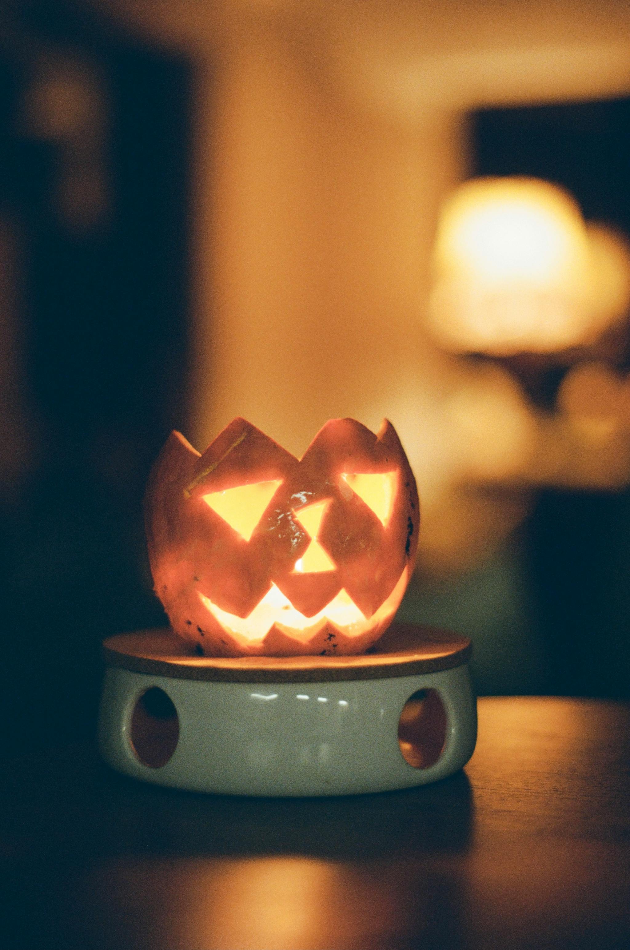 Person Holding a Toy Jack O Lantern with a Ghost · Free Stock Photo