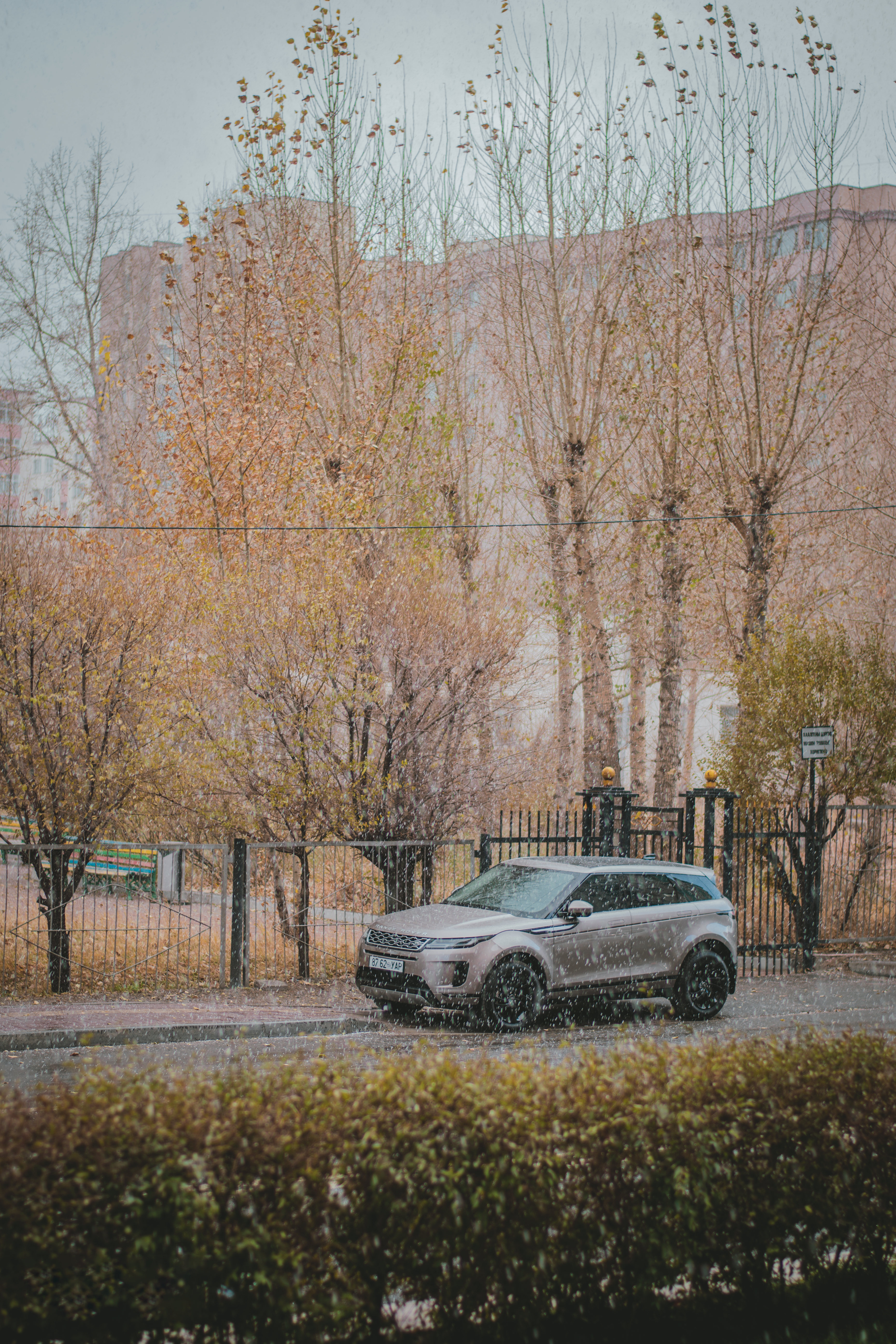 Sleek black Range Rover Sport parked on a city street