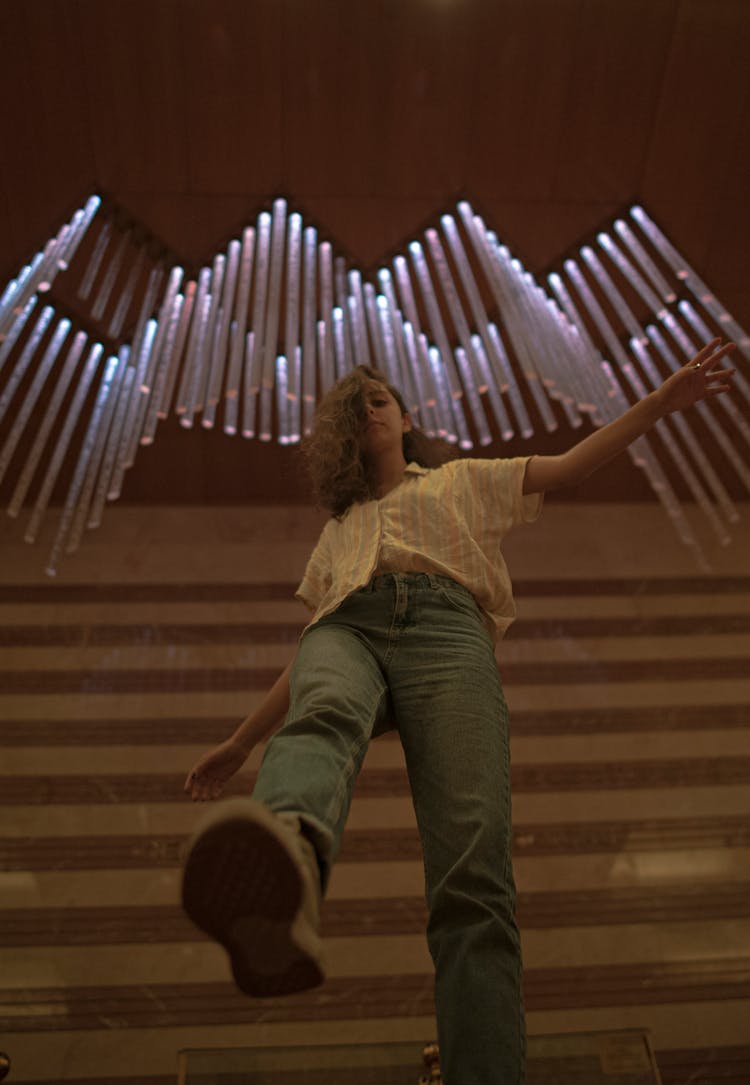 Low Angle Shot Of Woman On Steps