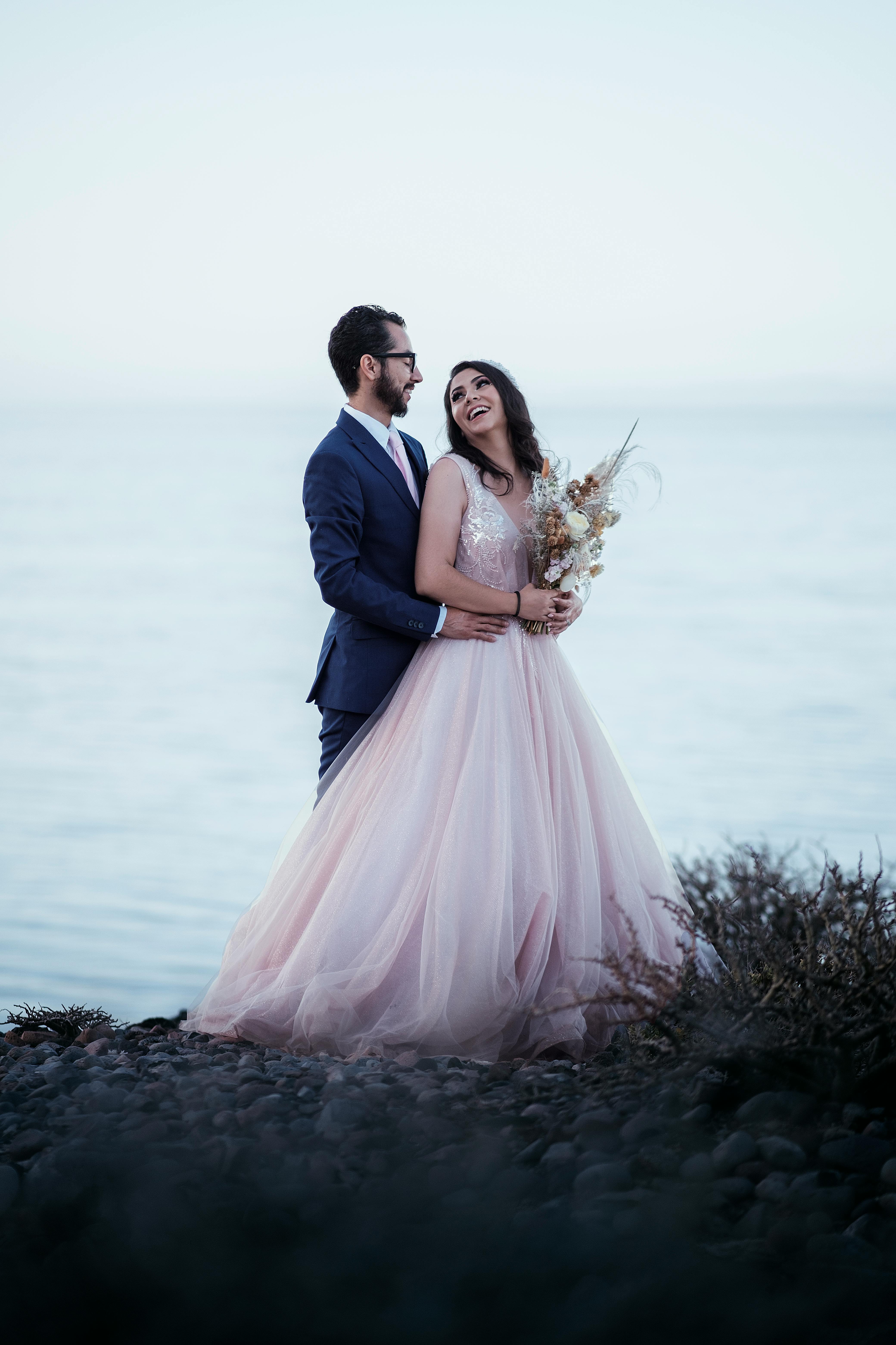 portrait of bride and groom on shore