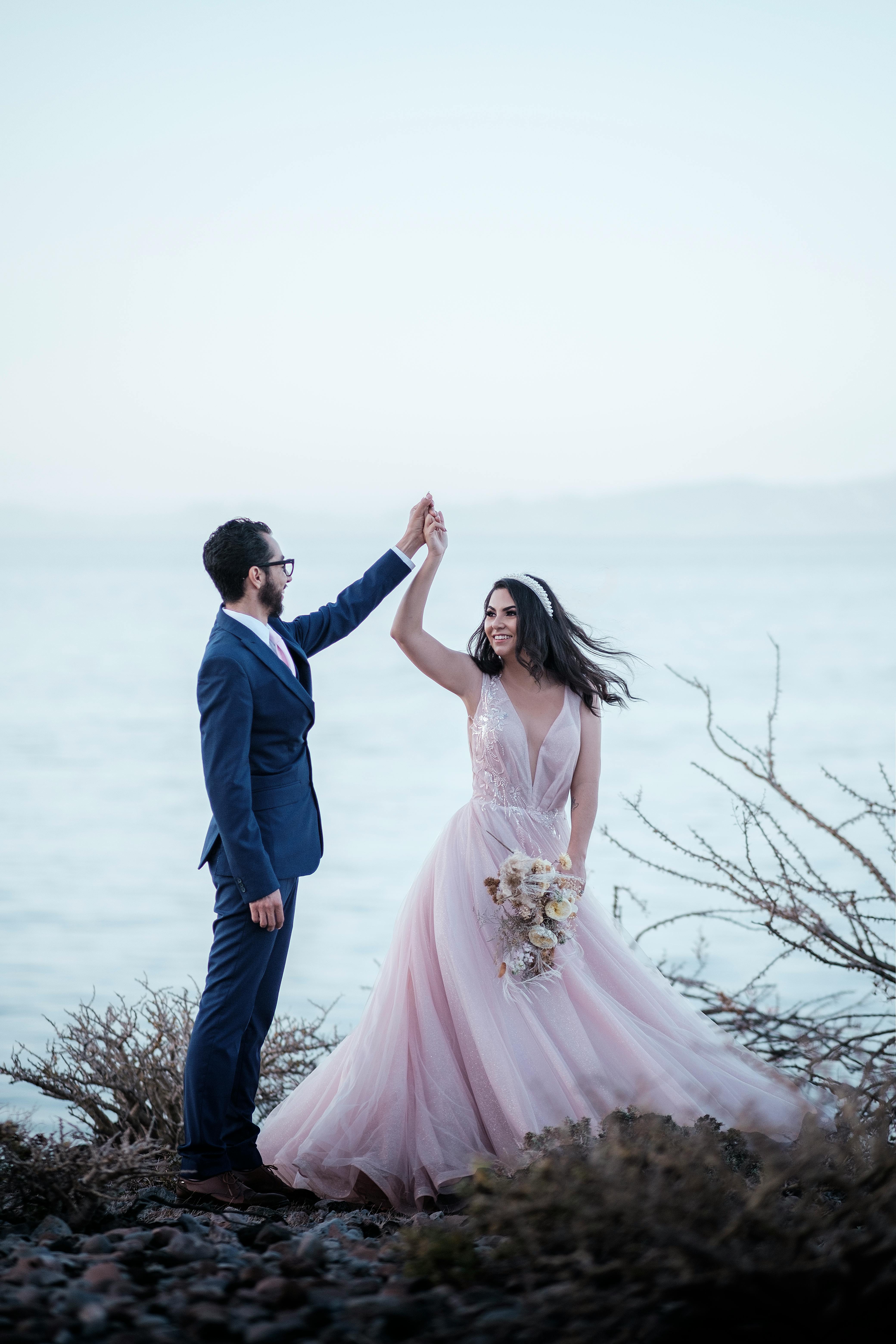 portrait of bride and groom on seashore