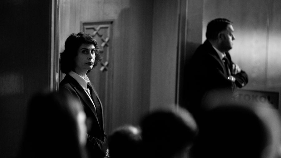 Security staff in suits standing watch at a private event