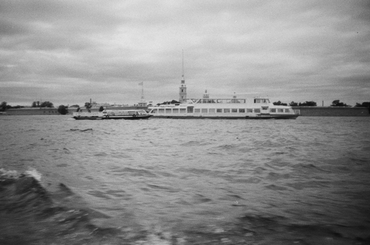 Monochrome image of a cruise ship sailing on a river in Saint Petersburg, Russia.