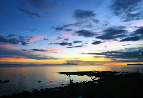 Безкоштовне стокове фото на тему «Берегова лінія, березі моря, Захід сонця»