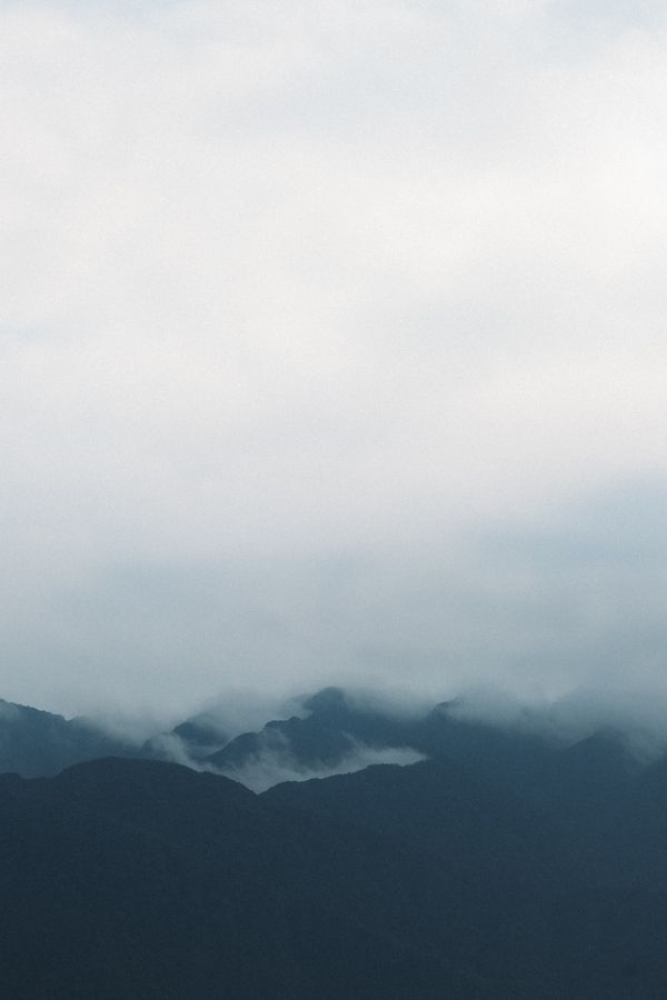 Fog over mountain peaks, photo by Thanh Luu on Pexels