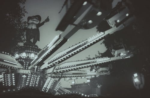 Black And White Photo of A Fairground Ride