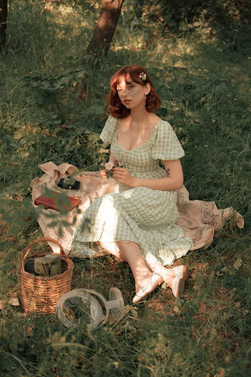 Portrait of Woman Holding Flowers at Picnic