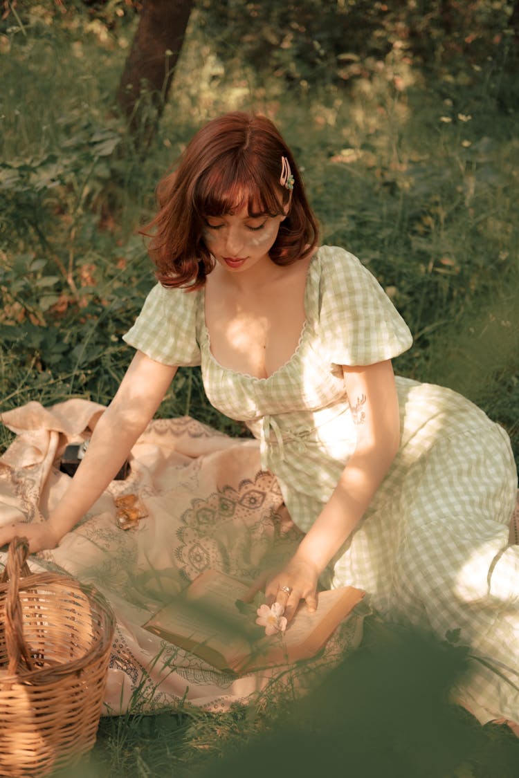 Portrait Of Woman Having Picnic And Reading