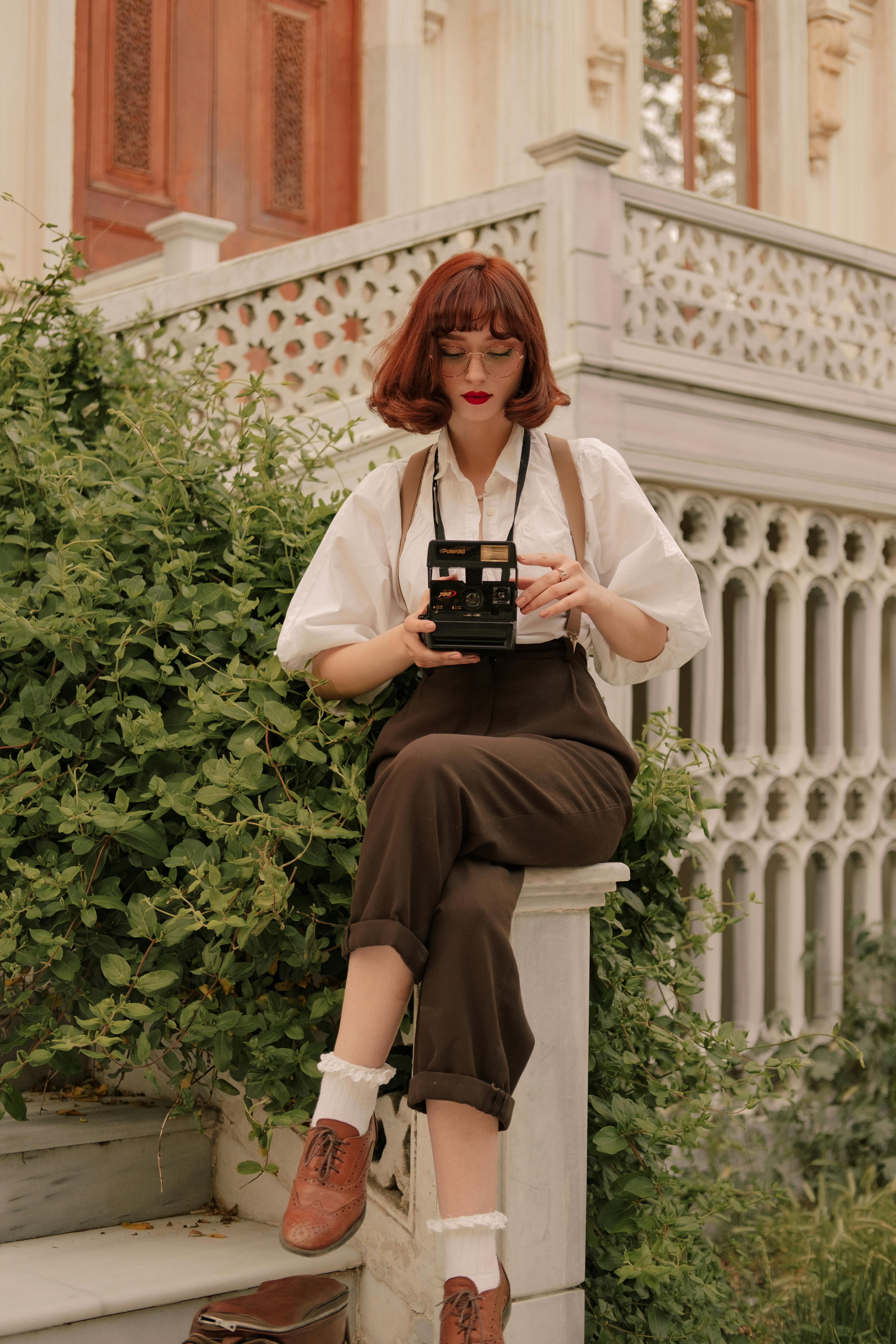 portrait of woman with vintage camera